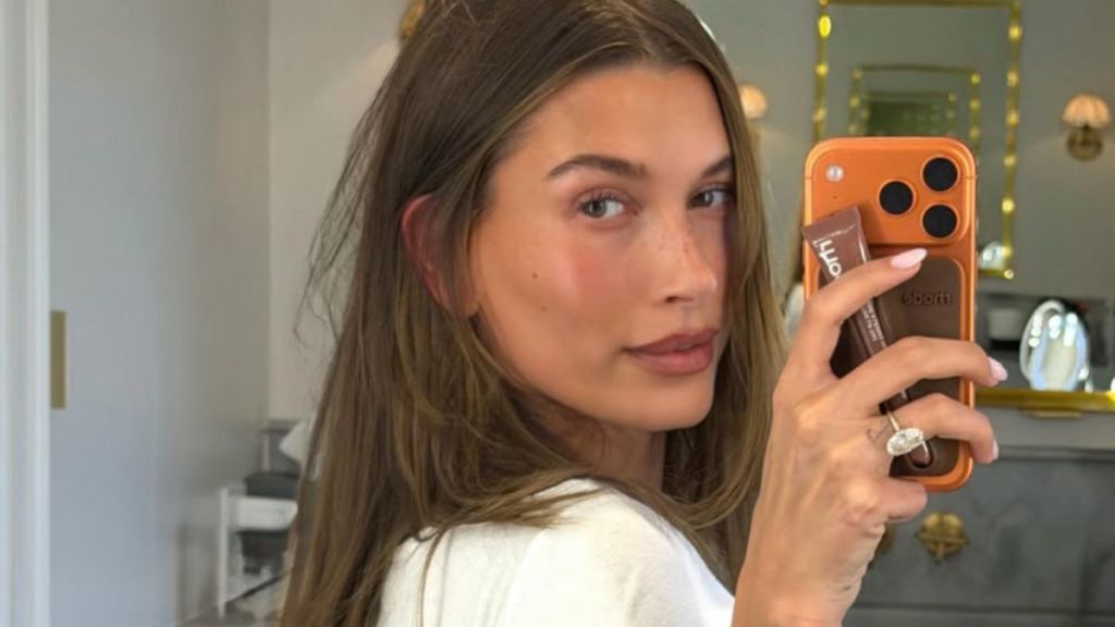 Hailey Bieber Rolls in Sand in Teeny Tiny Bikini