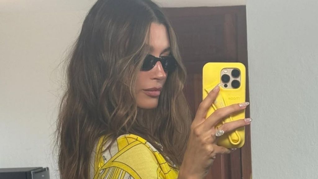 Hailey Bieber’s Plunging Bra Top Barely Stays on During Selfie Moment