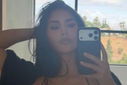 Kim Kardashian’s Dress Dips Dangerously Low While Hanging on by Thin Straps