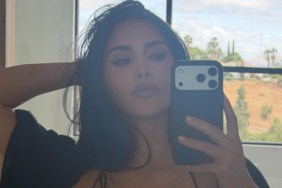 Kim Kardashian’s Dress Dips Dangerously Low While Hanging on by Thin Straps