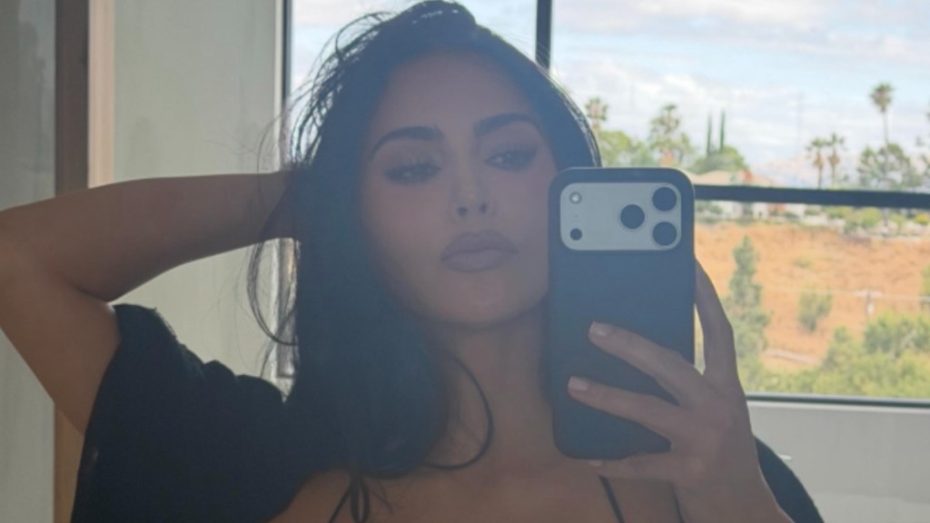 Kim Kardashian’s Dress Dips Dangerously Low While Hanging on by Thin Straps