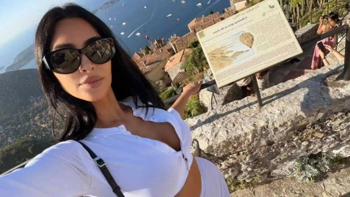 kim-kardashian-nearly-spills-out-of-unbuttoned-top-as-she-walks-mandatory