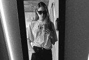 Karen Gillan Spreads Out on Table in Slip Dress That Shows off Her Thighs