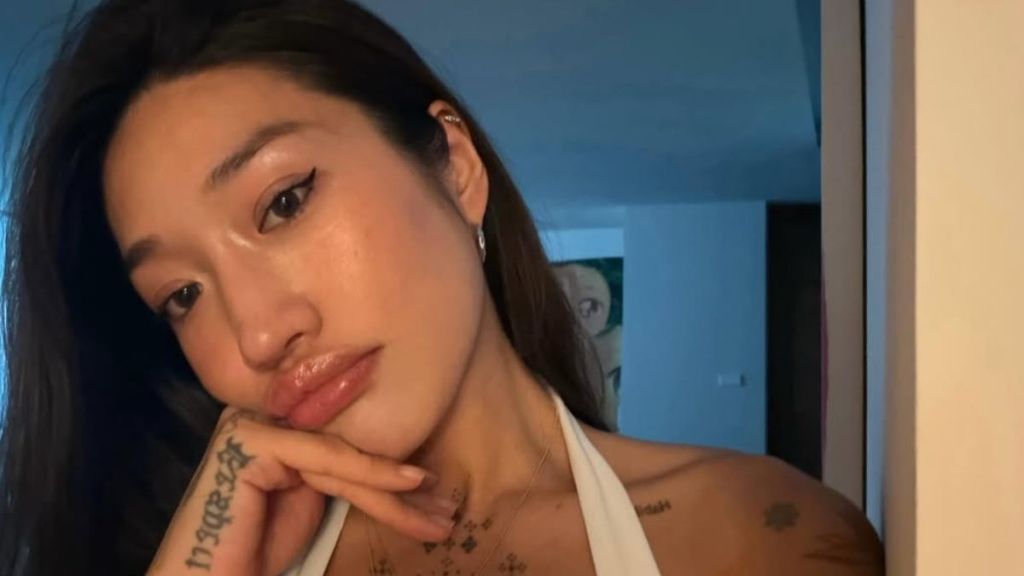 Peggy Gou’s Plunging Top Puts Her Cleavage Tattoos Front & Center