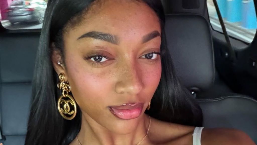 Angel Reese’s Plunging Bra Top Keeps All Eyes on Her Knockout Figure