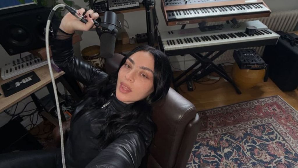 Charli XCX Goes Braless in Fully Unbuttoned Jacket Barely Put Together