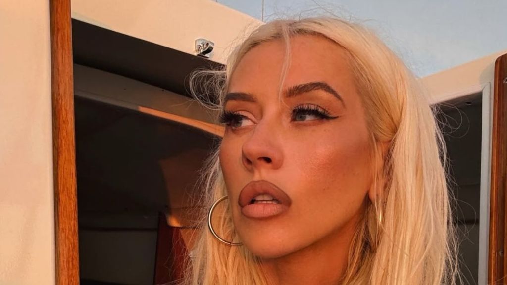 Christina Aguilera Walks In a Low-Cut Dress That Leaves Very Little Covered