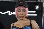 Doja Cat Spreads Her Legs on Stage in Daring Bow-Adorned Fit