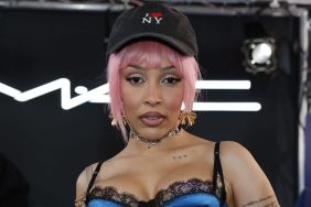 Doja Cat Spreads Her Legs on Stage in Daring Bow-Adorned Fit