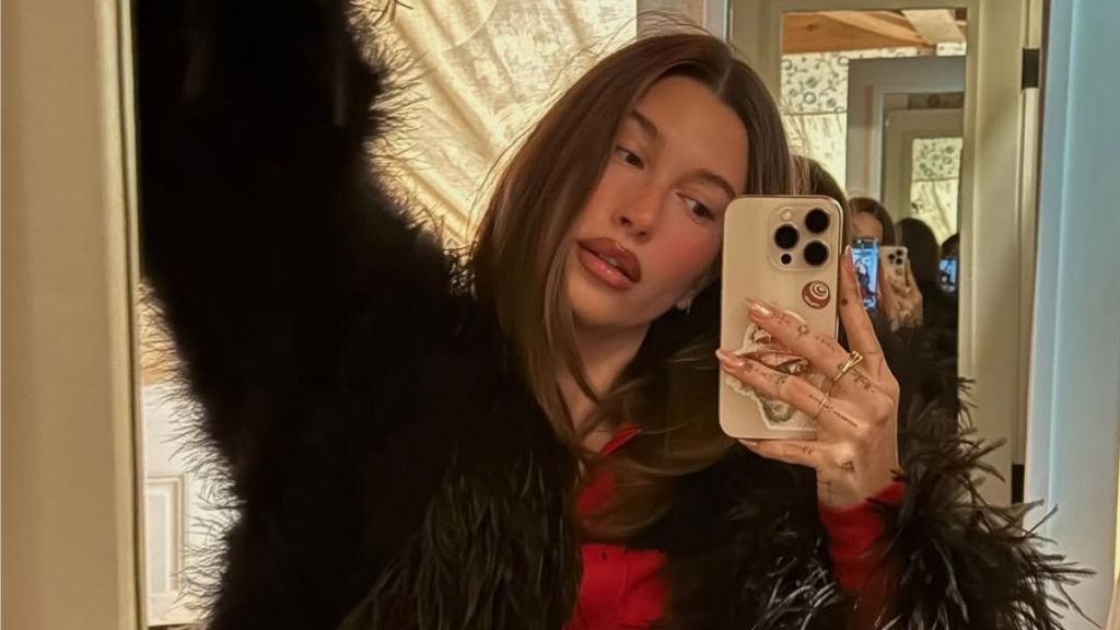 Hailey Bieber’s Loosely-Tied Robe Plunges Down To Expose Flirty Bra