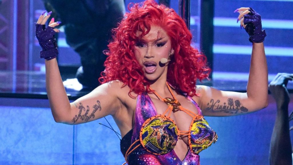 Cardi B Nearly Spills Out of Deeply Plunging Fit With Tattooed Bare Back
