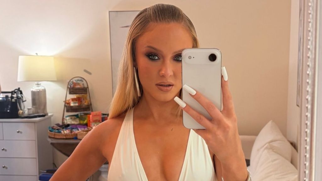 Zara Larsson Holds Her Bathrobe From Falling Apart & Exposing It All