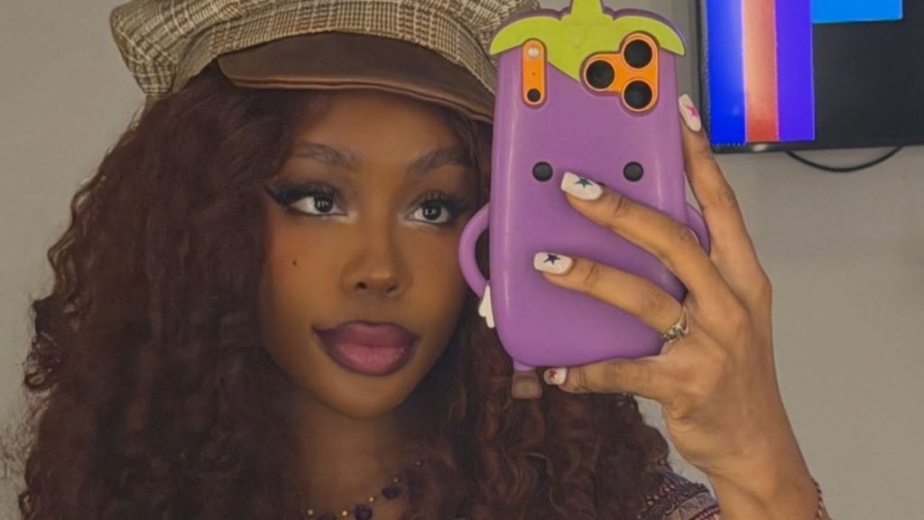 SZA’s Navel-Grazing Plunging Dress Leaves Very Little Covered