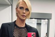 Charlize Theron Walks in Micro Shorts That Completely Hide Under Her Unbuttoned Jacket