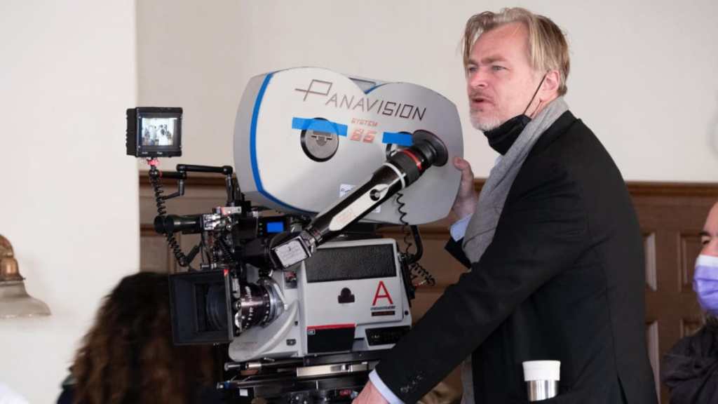 Christopher Nolan stands behind the camera.