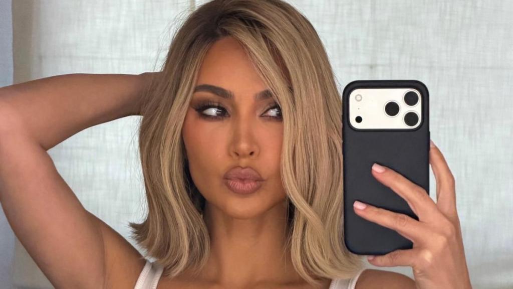 Kim Kardashian's Skimpy String Bikini Top Barely Contains Her Curves