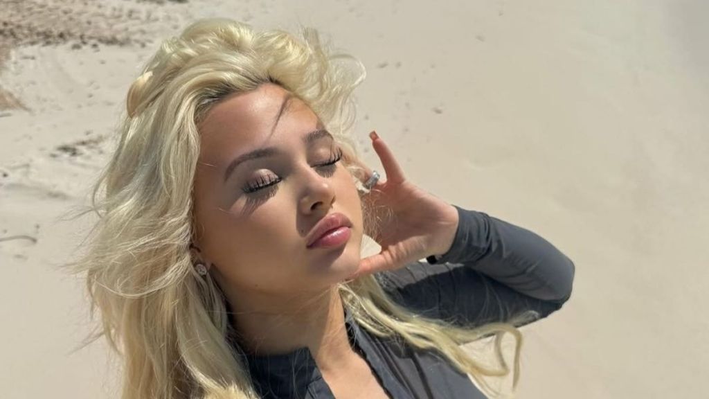 Alabama Barker’s Figure-Hugging Dress Clings to Her Curves in All the Right Places