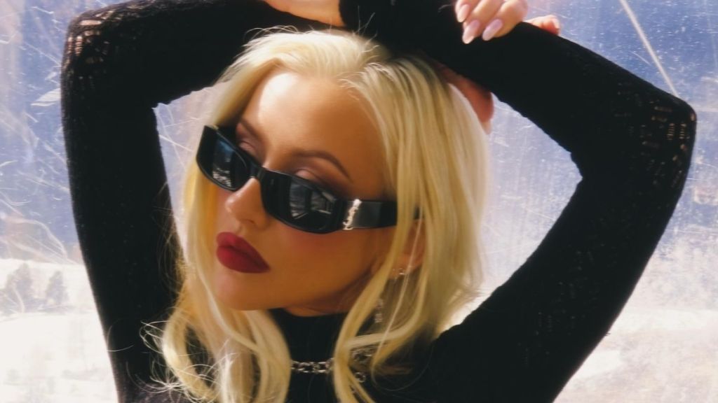 Christina Aguilera Strikes a Daring All-Fours Pose in a Dress That Dips Dangerously Low