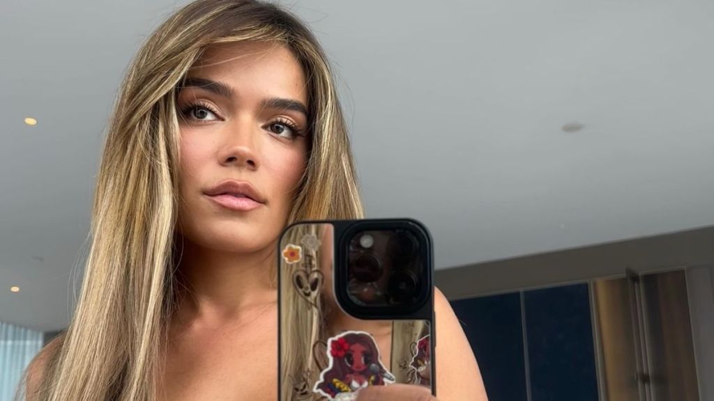 Karol G Drops Her Teeny Tiny Shorts a Little Too Low To Cause Frenzy