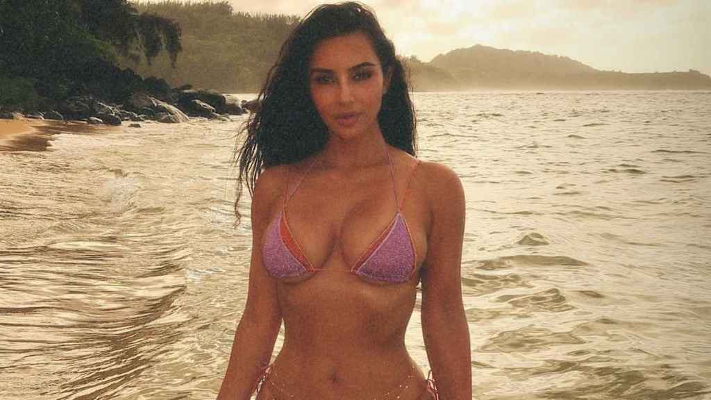 Kim Kardashian Gets Cheeky on the Beach in Fully See-Through Skirt