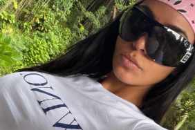 Kim Kardashian Keeps Her Pink Sweater Nearly Open on Holiday With Her Boyfriend