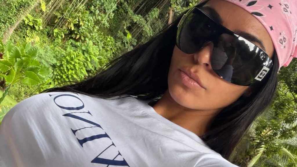 Kim Kardashian Keeps Her Pink Sweater Nearly Open on Holiday With Her Boyfriend
