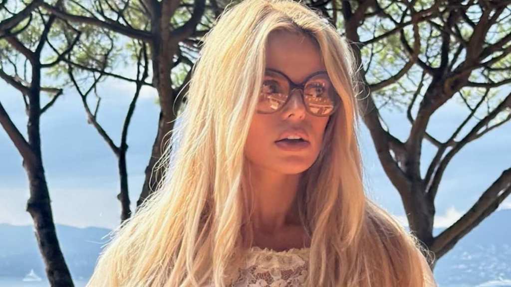 Brooks Nader Risks It All in a Plunging Dress With Daring Waist-High Slit