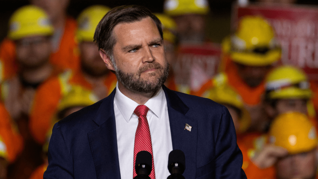 J.D. Vance speaking at a podium amid his blunt assessments of prominent political figures