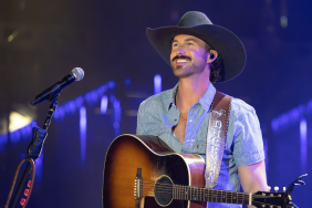 Riley Green uses a drumstick to pick up underwear thrown onstage during his Maine concert