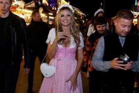 Heidi Klum’s Curves Barely Fit Into Plunging Lacy Dress for Oktoberfest