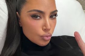 Kim Kardashian Wears Nothing but a Robe That Barely Contains Her Curves