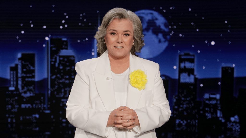 Rosie O’Donnell joins Jeffrey Epstein survivors in a show of solidarity while performing “I Am Woman”