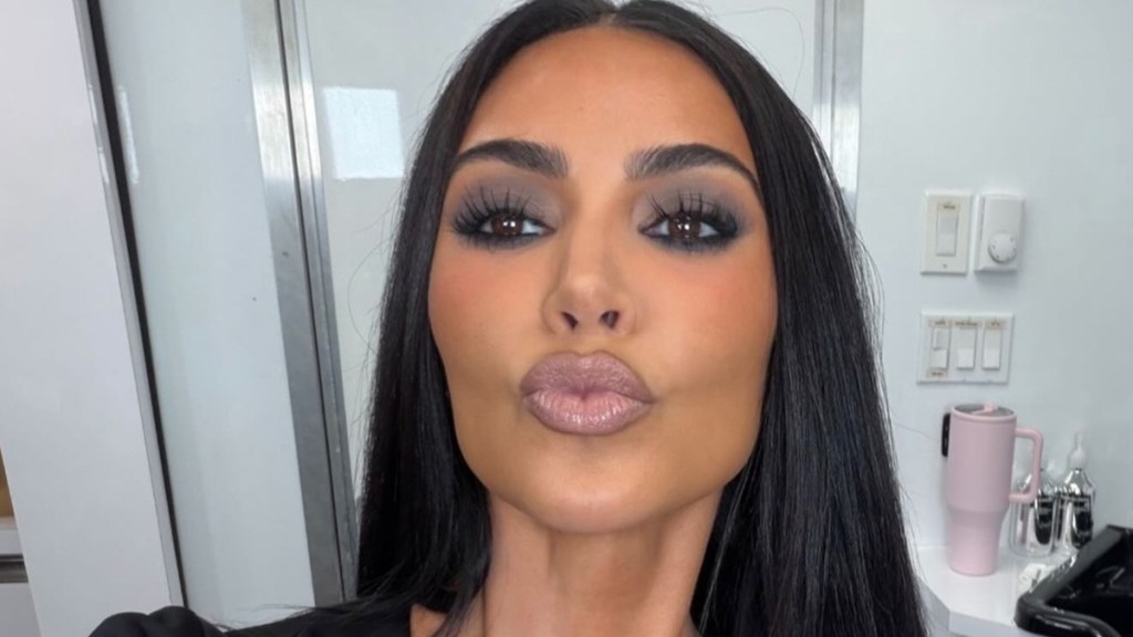 Kim Kardashian Is Almost Unrecognizable in Scary Blue Hair & Black Teeth Halloween Photos
