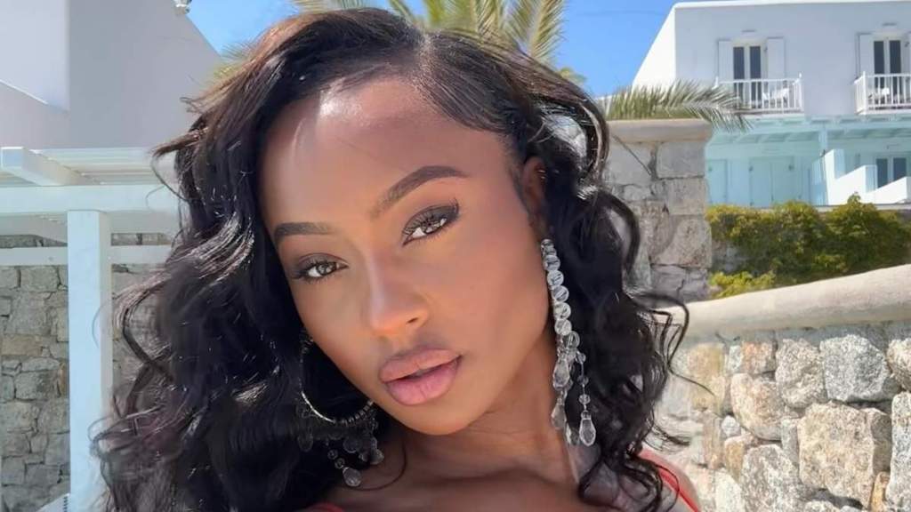 Travis Kelce’s Ex Puts Her Curves on Full Display in a See-Through Mini
