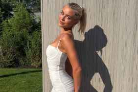 Livvy Dunne Serves Beer & a Whole Lotta Curves in Body-Hugging Tank Top