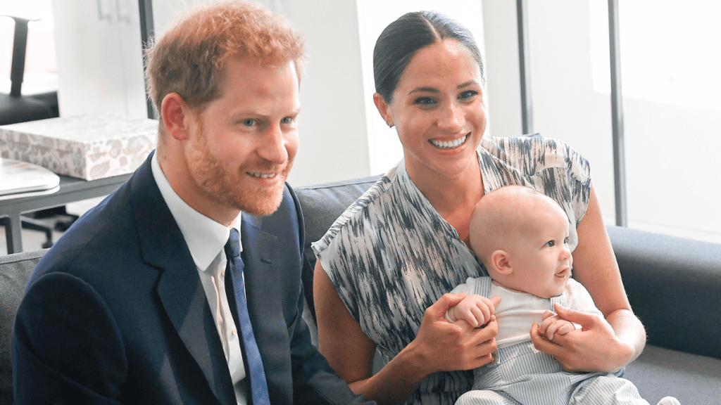Meghan Markle holds a young Prince Archie as the Sussex family begins a new chapter in the U.K.