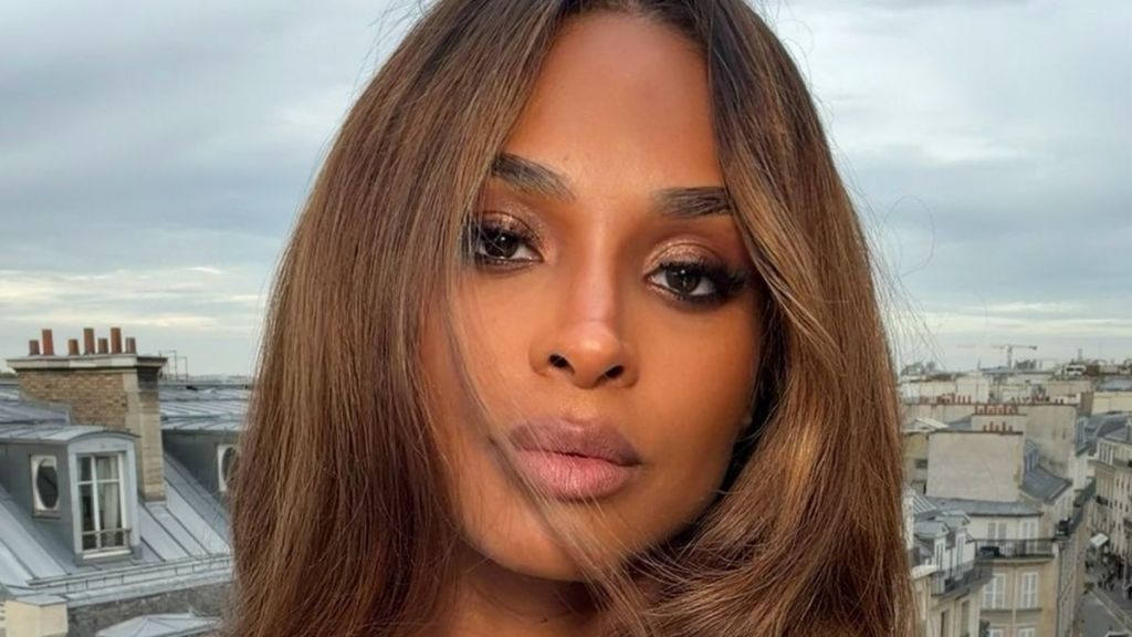 Ciara Poses in a Plunging White Shirt With Her Legs on Full Display