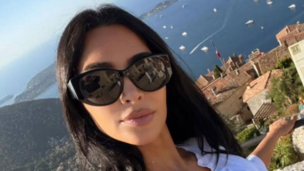 Kim Kardashian Strikes a Sultry Pose in a Dress That Barely Covers Her Curves