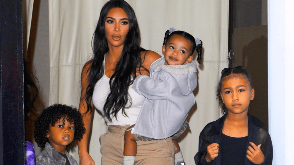 Kim Kardashian opens up about raising her four children with the help of five nannies while staying involved in their daily routines.