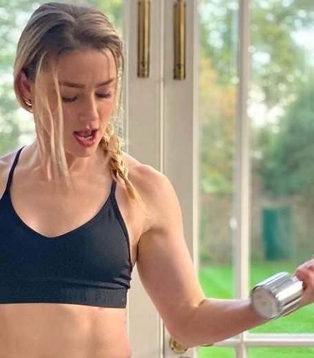 Amber Heard Pumps Iron With an Unlikely Workout Buddy in New Instagram Pics