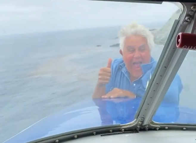 Meanwhile in Malibu: Jay Leno Rides the Nose of an Airplane Mid-Flight Just Because He Can (Video)