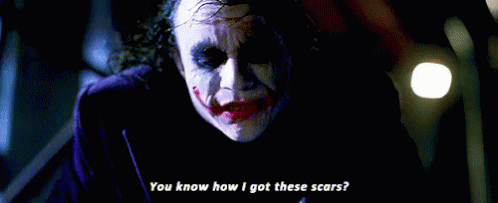 How did the Joker get those scars in 'The Dark Knight?'