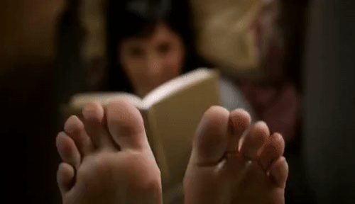 Sucking her (disgusting) toes.
