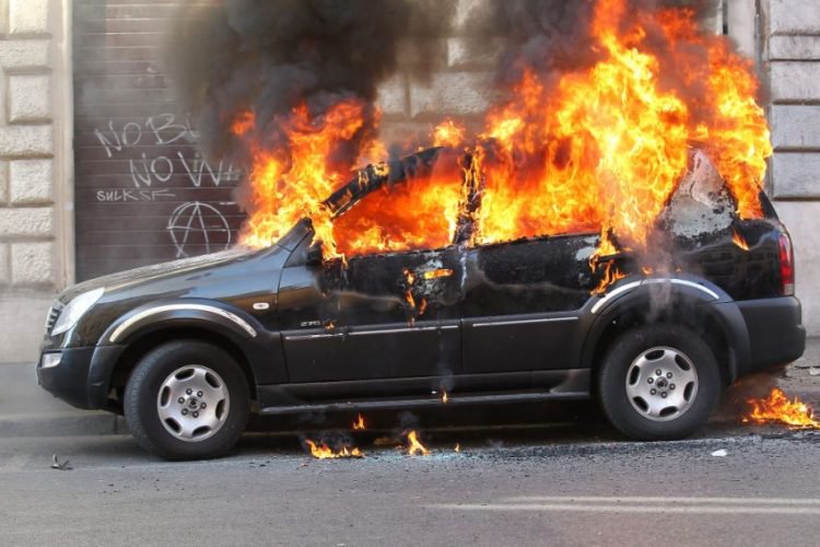 Crazy Man Lights Cars on Fire, Gets Beat Up By Hawaiian Shirt Guy